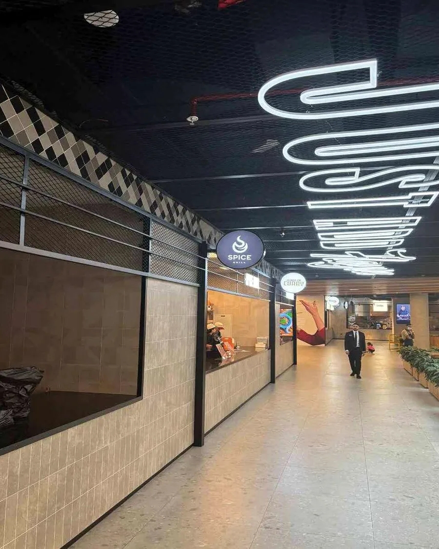 Flayva & Glitch — signage detail, Al Ghurair Centre, Tower 1 — Dubai