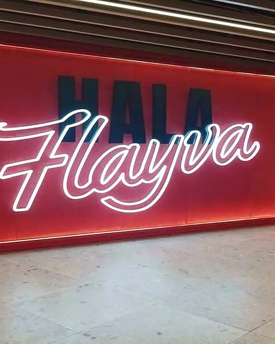 Flayva & Glitch — signage detail, Al Ghurair Centre, Tower 1 — Dubai