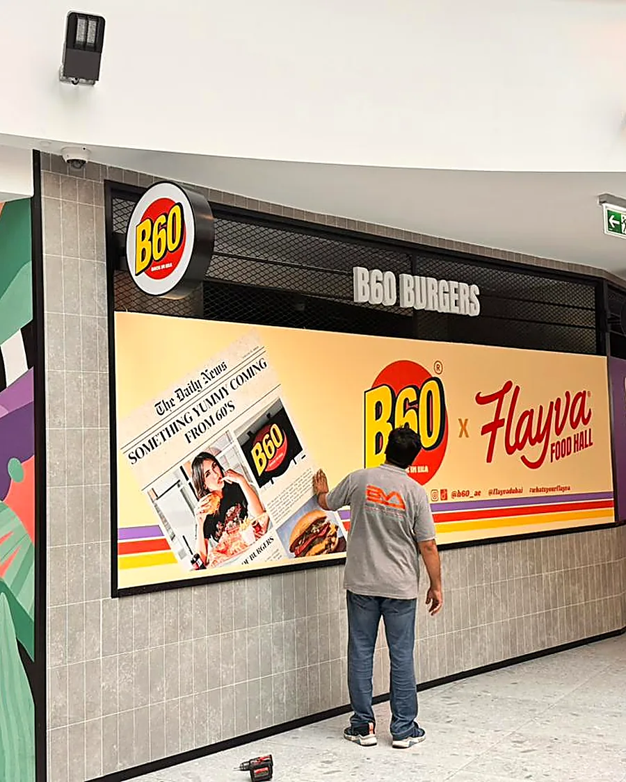 B60 & Flayva Barricade — Hoarding & Fencing signage by Brand Visual Advertising